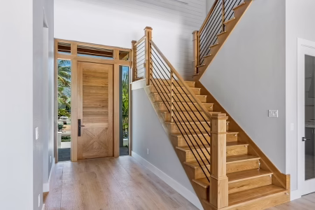 Double swinging entry door with modern design on Florida home