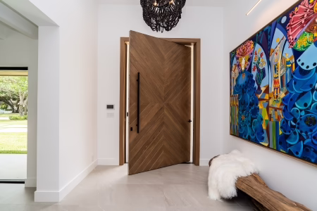 Modern pivot door entry on luxury Florida home