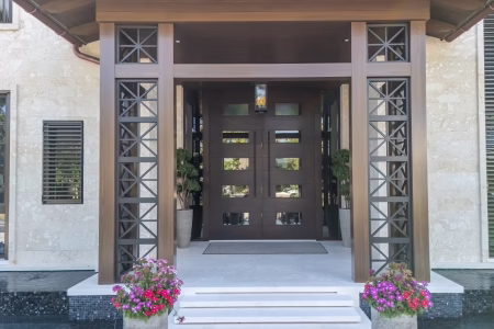 Impact-rated door assembly with reinforced frame and glazing.