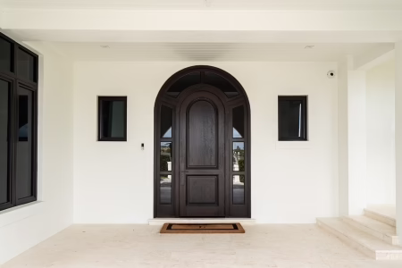 Wood entry door detail with natural grain finish