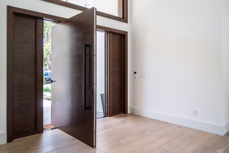 Pivot entry door with FritsJurgens hidden pivot system on Florida home.
