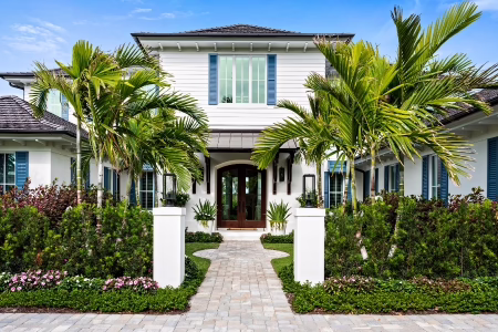 Custom Accoya entry door installed on luxury Florida home. 