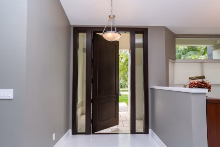 Flush exterior wood door design with clean, minimalist wood grain surface